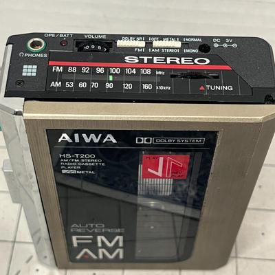 Sale Photo Thumbnail #910: Classic Aiwa cassette player with three TDK D90 blank tapes.