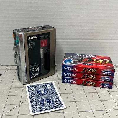 Sale Photo Thumbnail #905: Classic Aiwa cassette player with three TDK D90 blank tapes.
