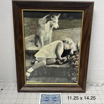 Sale Photo Thumbnail #928: Classic vintage framed photo featuring child and dog, wood frame included.
