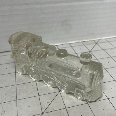 Sale Photo Thumbnail #936: Decorative clear glass train engine collectible, perfect vintage display piece.