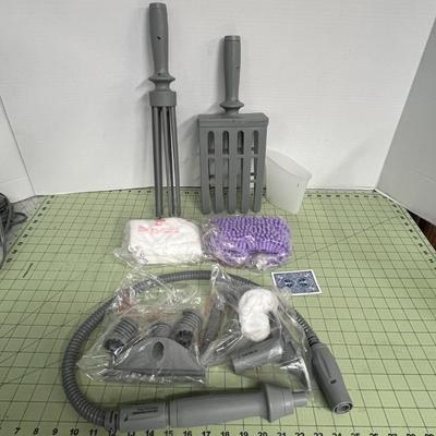 Sale Photo Thumbnail #959: Open box, unused handheld steamer cleans and sanitizes surfaces effectively.