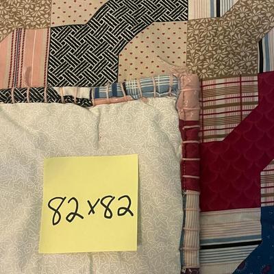 Sale Photo Thumbnail #1017: Colorful hand-tied quilt with classic geometric patterns