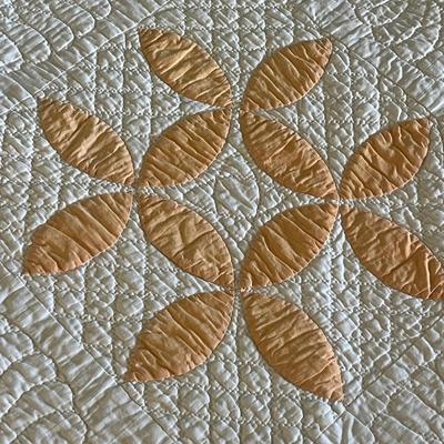 Sale Photo Thumbnail #1101: Hand-stitched quilt with peach appliqué flower design