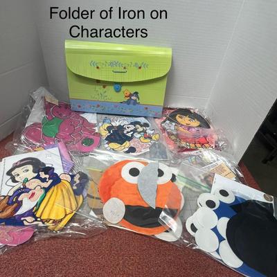 Sale Photo Thumbnail #1123: Includes folder with assorted cartoon iron-on appliqués