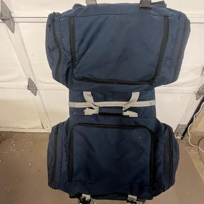 Sale Photo Thumbnail #1388: Spacious navy bag with zipper compartments, versatile carry