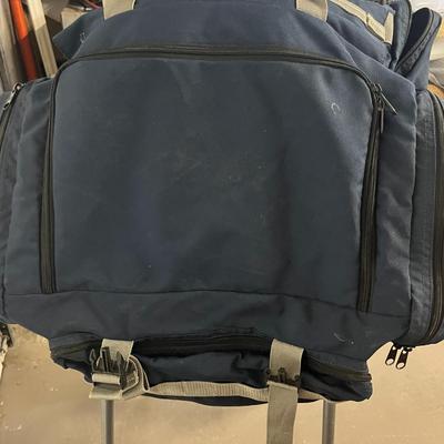 Sale Photo Thumbnail #1385: Spacious navy bag with zipper compartments, versatile carry
