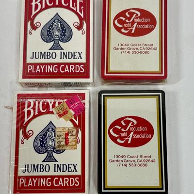 Sale Photo Thumbnail #342: 2 packs of Bicycle Jumbo Index Playing Cards and 2 packs of Production Credit Association cards.