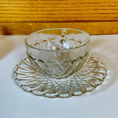 LOT 63: Large Assortment of Clear Glass Serving Pieces Some Etched Fruit