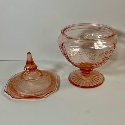 LOT 69: Large Selection of Pink Depression Glass Including Raised Platters, Covered Bowl, Candy Dish with Lid, Stemmed Glassed and Tooth...