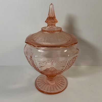 LOT 69: Large Selection of Pink Depression Glass Including Raised Platters, Covered Bowl, Candy Dish with Lid, Stemmed Glassed and Tooth...