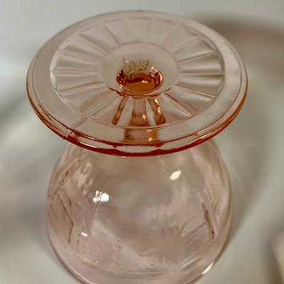 LOT 69: Large Selection of Pink Depression Glass Including Raised Platters, Covered Bowl, Candy Dish with Lid, Stemmed Glassed and Tooth...
