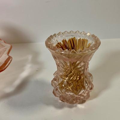 LOT 69: Large Selection of Pink Depression Glass Including Raised Platters, Covered Bowl, Candy Dish with Lid, Stemmed Glassed and Tooth...