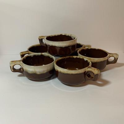 LOT 77: Collection of Brown Drip Glaze Pottery Including Pfaltzgraff Bean Pot and Serving Platter, Cups, Bowls and Platter by Various Makers