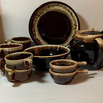 LOT 77: Collection of Brown Drip Glaze Pottery Including Pfaltzgraff Bean Pot and Serving Platter, Cups, Bowls and Platter by Various Makers