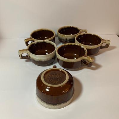 LOT 77: Collection of Brown Drip Glaze Pottery Including Pfaltzgraff Bean Pot and Serving Platter, Cups, Bowls and Platter by Various Makers