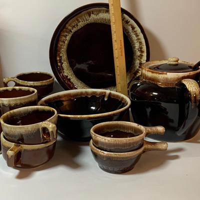 LOT 77: Collection of Brown Drip Glaze Pottery Including Pfaltzgraff Bean Pot and Serving Platter, Cups, Bowls and Platter by Various Makers