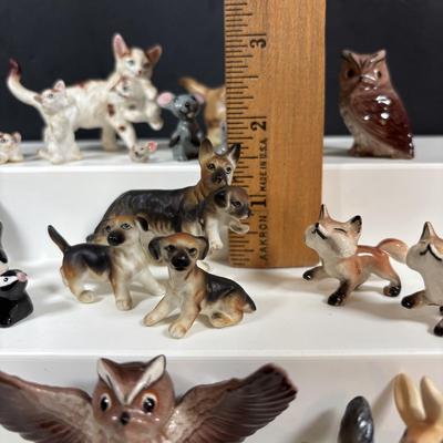 LOT 109: Wonderful World of Miniatures: Smokey the Bear, Owls, Cats. Skunk, Dogs and More