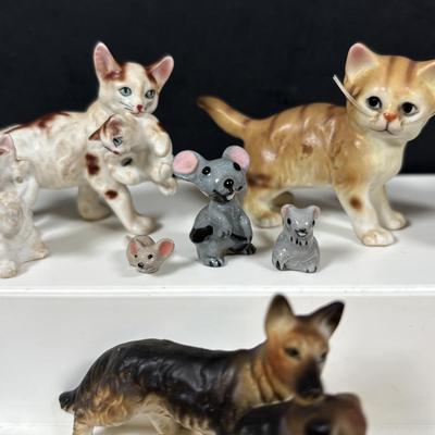 LOT 109: Wonderful World of Miniatures: Smokey the Bear, Owls, Cats. Skunk, Dogs and More