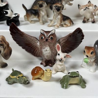 LOT 109: Wonderful World of Miniatures: Smokey the Bear, Owls, Cats. Skunk, Dogs and More