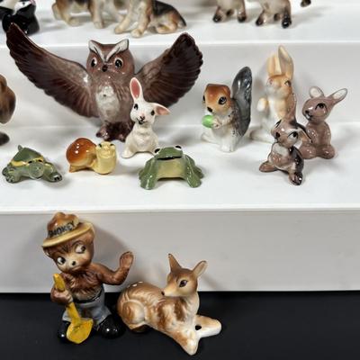 LOT 109: Wonderful World of Miniatures: Smokey the Bear, Owls, Cats. Skunk, Dogs and More