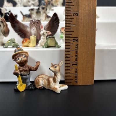 LOT 109: Wonderful World of Miniatures: Smokey the Bear, Owls, Cats. Skunk, Dogs and More