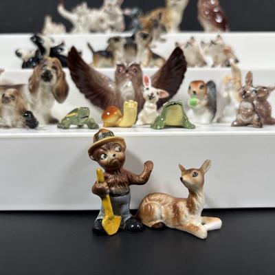 LOT 109: Wonderful World of Miniatures: Smokey the Bear, Owls, Cats. Skunk, Dogs and More