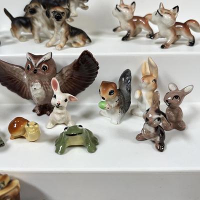 LOT 109: Wonderful World of Miniatures: Smokey the Bear, Owls, Cats. Skunk, Dogs and More