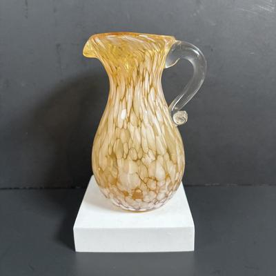 LOT 115: Beautiful Glass Collection: Amber/Gold Handblown Pitcher, Multi Color Art Glass Vase (orange, red, blue) and Cranberry Pitcher