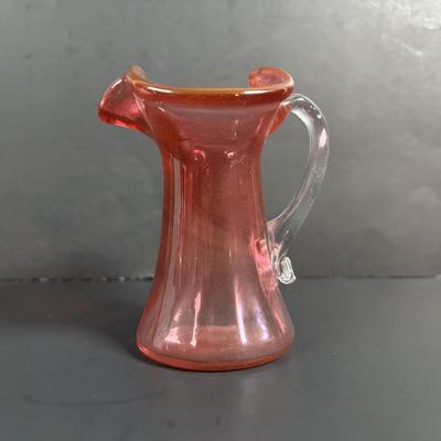 LOT 115: Beautiful Glass Collection: Amber/Gold Handblown Pitcher, Multi Color Art Glass Vase (orange, red, blue) and Cranberry Pitcher