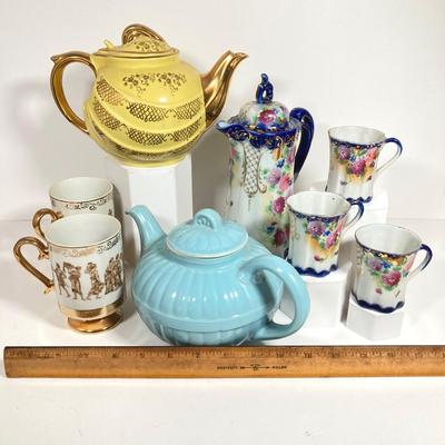LOT 137: Collection of Hand Painted Tea Pots and Cups - Hall, Royal Crown and More