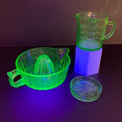 LOT 138: Uranium Glass Collection - Juicer, Measuring Cup and Coaster