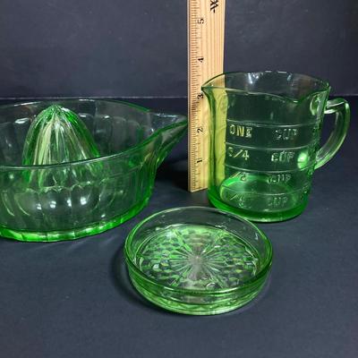 LOT 138: Uranium Glass Collection - Juicer, Measuring Cup and Coaster