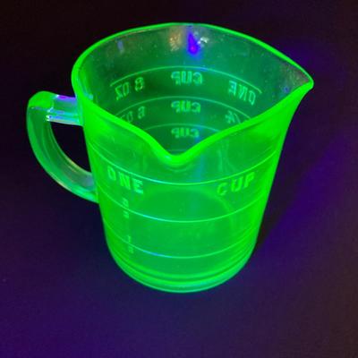 LOT 138: Uranium Glass Collection - Juicer, Measuring Cup and Coaster
