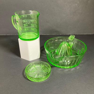 LOT 138: Uranium Glass Collection - Juicer, Measuring Cup and Coaster