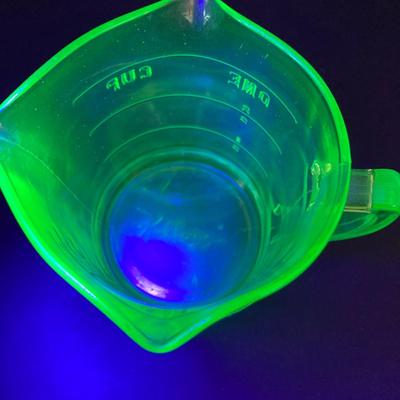 LOT 138: Uranium Glass Collection - Juicer, Measuring Cup and Coaster