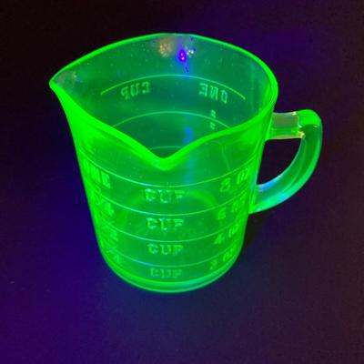 LOT 138: Uranium Glass Collection - Juicer, Measuring Cup and Coaster