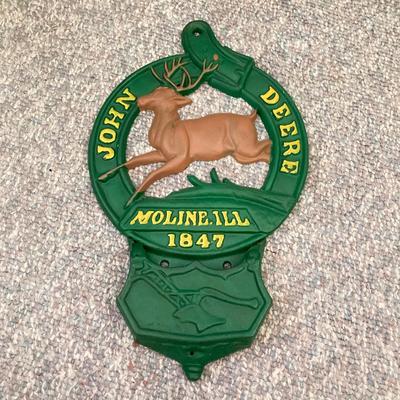 LOT 143: John Deere Tractor Collection - Moline, Ill 1847 Cast Iron Wall Mount Mail Holder / Plaque, Tin Sign, Pair of Caps and More