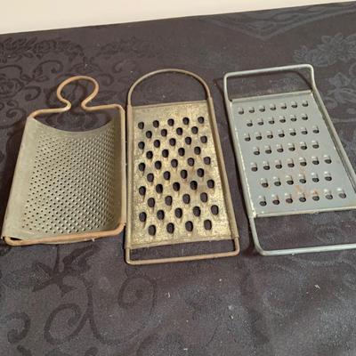 LOT 165: Vintage Kitchen Gadgets Featuring Wagner Kristy Korn Kobs Junior Cornbread Molds, Graters, Strainers and More