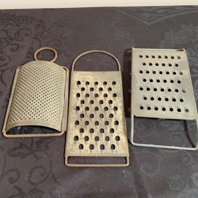 LOT 165: Vintage Kitchen Gadgets Featuring Wagner Kristy Korn Kobs Junior Cornbread Molds, Graters, Strainers and More