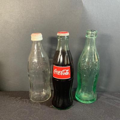 LOT 173: Coke/Coca Cola Collection with Tins, Glasses, Vintage Bottles and More