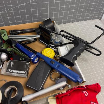 Sale Photo Thumbnail #1299: Flash Light, Sling Shot, Lighter etc. Usable stuff. 