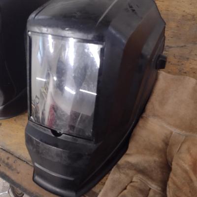 Pair of Welding Helmets and Gloves for Hot Work