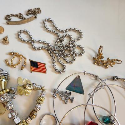 Sale Photo Thumbnail #202: This auction lot is for a Bag of Costume Jewelry.  This is a real mix of items found in a dresser drawer.  There are necklaces, earrings, pins, rings and other miscellaneous items - please see pictures.  Grab this deal quick.