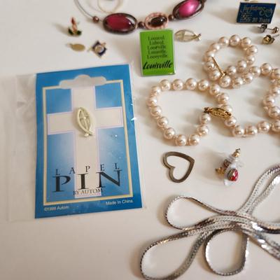 Sale Photo Thumbnail #206: This auction lot is for a Bag of Costume Jewelry.  This is a real mix of items found in a dresser drawer.  There are necklaces, earrings, pins, rings and other miscellaneous items - please see pictures.  Grab this deal quick.
