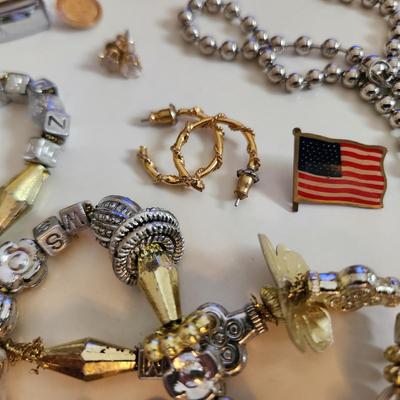 Sale Photo Thumbnail #209: This auction lot is for a Bag of Costume Jewelry.  This is a real mix of items found in a dresser drawer.  There are necklaces, earrings, pins, rings and other miscellaneous items - please see pictures.  Grab this deal quick.