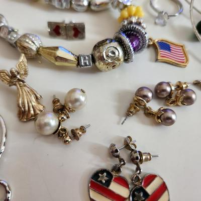 Sale Photo Thumbnail #208: This auction lot is for a Bag of Costume Jewelry.  This is a real mix of items found in a dresser drawer.  There are necklaces, earrings, pins, rings and other miscellaneous items - please see pictures.  Grab this deal quick.