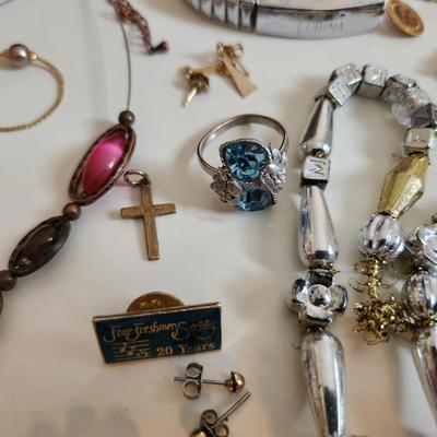 Sale Photo Thumbnail #207: This auction lot is for a Bag of Costume Jewelry.  This is a real mix of items found in a dresser drawer.  There are necklaces, earrings, pins, rings and other miscellaneous items - please see pictures.  Grab this deal quick.