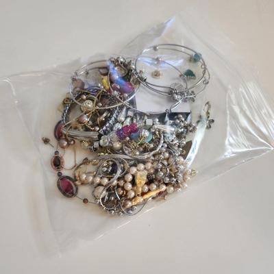 Sale Photo Thumbnail #212: This auction lot is for a Bag of Costume Jewelry.  This is a real mix of items found in a dresser drawer.  There are necklaces, earrings, pins, rings and other miscellaneous items - please see pictures.  Grab this deal quick.