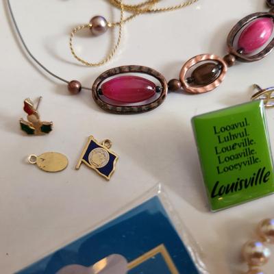 Sale Photo Thumbnail #210: This auction lot is for a Bag of Costume Jewelry.  This is a real mix of items found in a dresser drawer.  There are necklaces, earrings, pins, rings and other miscellaneous items - please see pictures.  Grab this deal quick.