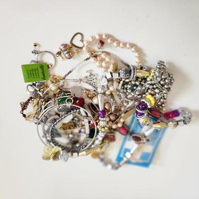 Sale Photo Thumbnail #198: This auction lot is for a Bag of Costume Jewelry.  This is a real mix of items found in a dresser drawer.  There are necklaces, earrings, pins, rings and other miscellaneous items - please see pictures.  Grab this deal quick.